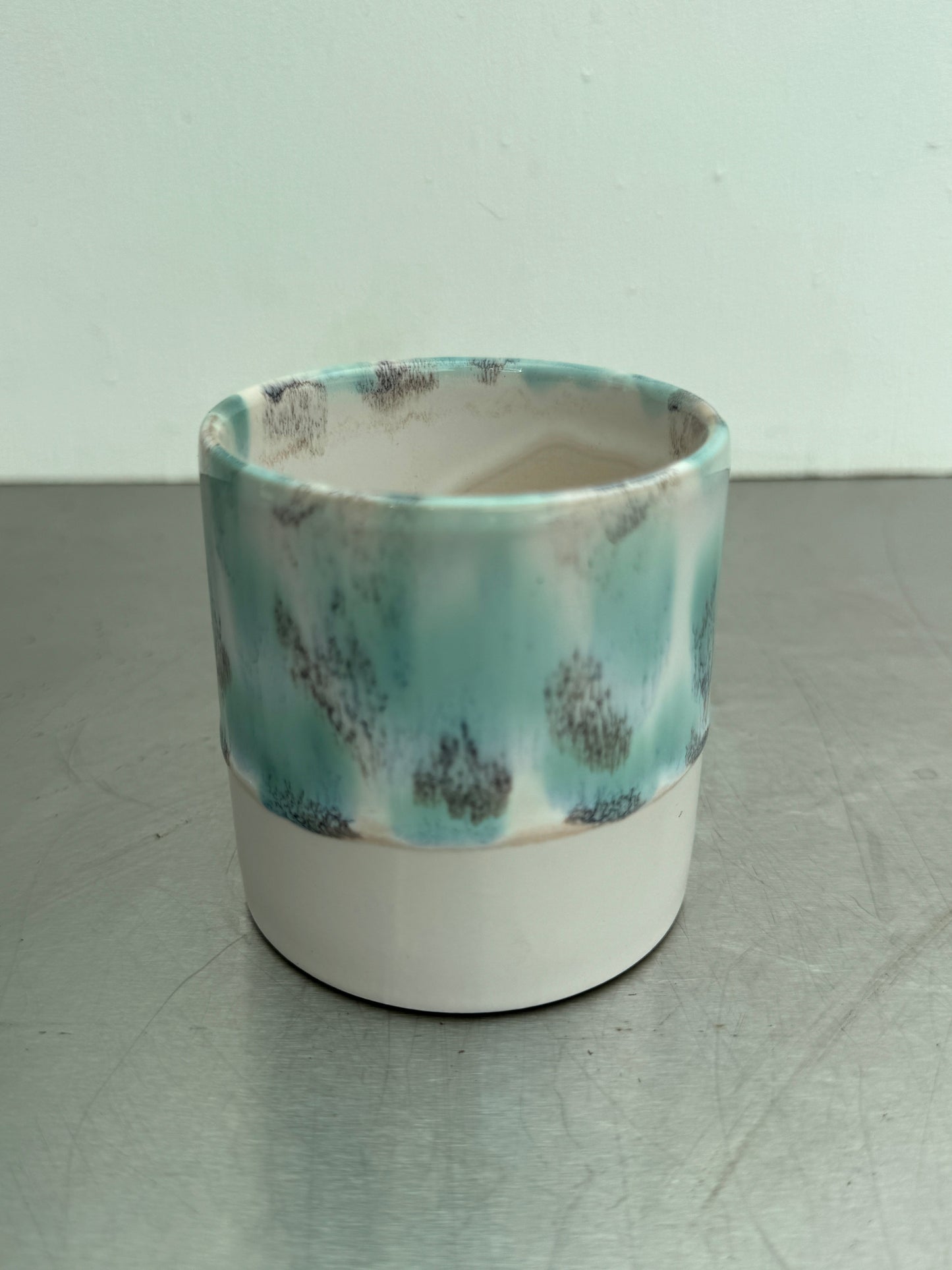 6 cm ceramic pot with turquoise and gray glaze over a white base, adding a fresh touch to home or greenhouse decor.